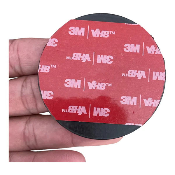 Close-up of the iRange Sports Tablet/iPad Disc showing the 3M VHB adhesive and 2.5-inch round steel plate